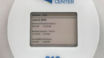 Albany Capital Center EPS room sign from Visix with custom cut frame and braille lettering