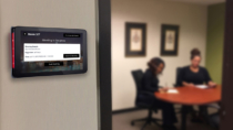 Connect Meeting Room Signs show when a meeting is in progress and change the lights to red