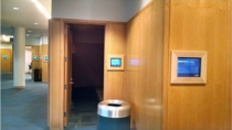 Kauffman Foundation uses Touch room signs recessed in walls with matching wood frames