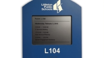 Littleton Public School District E Ink meeting room sign with custom branded faceplate