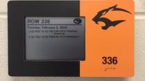 Neosho Community College E-Paper Room Sign and custom frame with raised numbers and braille