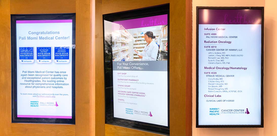 photo of three hospital screens showing digital signage for visitors, staff and patients