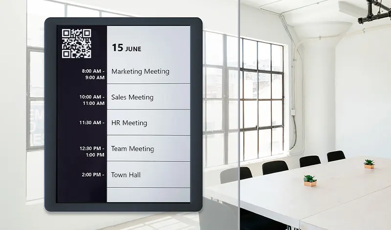 image of electronic paper room sign with meeting schedule and QR booking code
