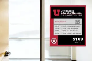 EPS 74 ePaper room sign mounted on glass with custom architectural faceplate