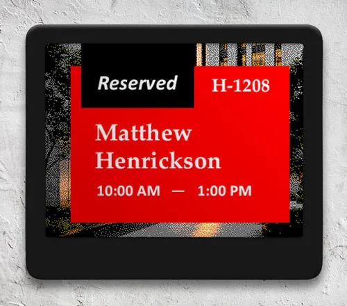 ePaper desk sign with desk reservation information in red block on graphic photo background