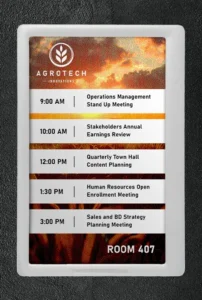 ePaper room sign in portrait orientation with sunset background and corporate branding showing meeting schedule, QR tag and logo