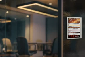 ePaper room sign in portrait orientation mounted on glass outside conference room