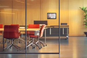 ePaper room sign with law office branding mounted on glass outside of conference room